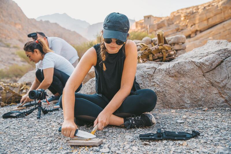 The team learn essential knife skills, such as how to carve a peg from wood.