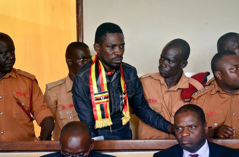 Bobi Wine, center, arrives at a magistrate's court in Gulu, northern Uganda, August 23, 2018. AP Photo