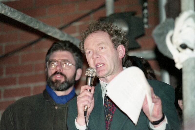The Sinn Fein's deputy leader, Martin McGuinness, and leader Gerry Adams at a rally in Belfast in December 1994. AP
