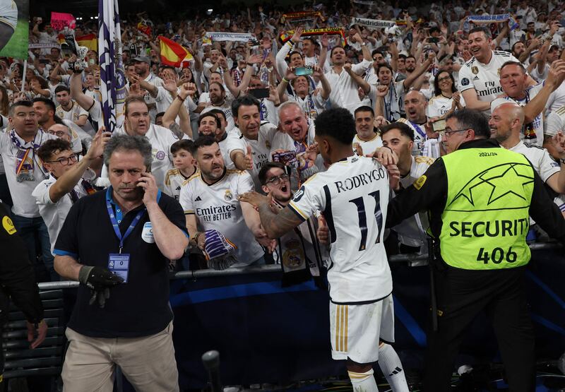 Rodrygo celebrates with fans at the end of the Champions League semi-final. AFP