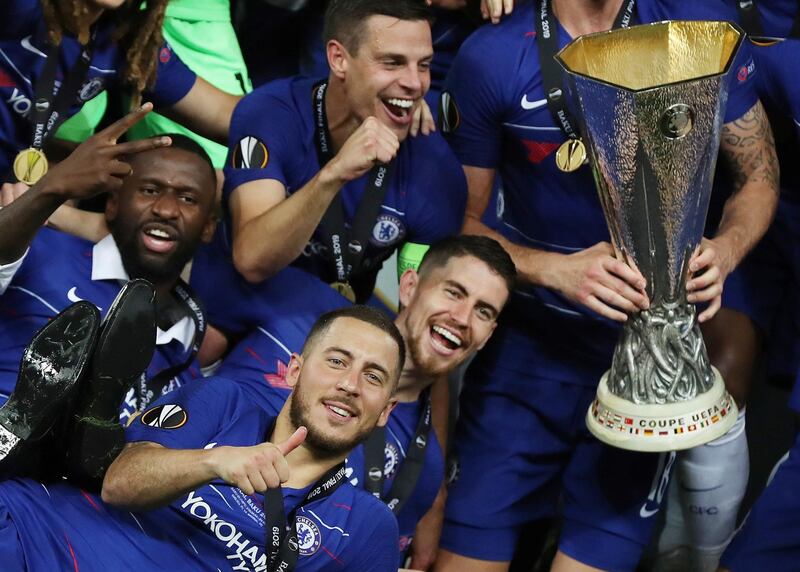 Hazard poses with the Europa League trophy with his Chelsea teammates. Reuters