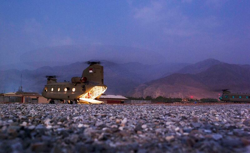 Light emanates from the inside of a CH-47 Chinook helicopter as it waits for passengers at FOB Joyce in Afghanistan's Kunar Province July 5, 2012. Picture taken July 5, 2012. REUTERS/Lucas Jackson  (AFGHANISTAN - Tags: CIVIL UNREST MILITARY TPX IMAGES OF THE DAY)