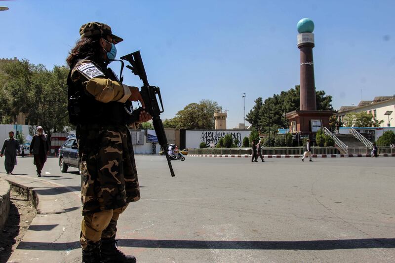 A Taliban fighter in military fatigues in Kabul. Demonstrators have taken to the streets of the Afghan capital and other cities to protest against the militant group's new government. EPA