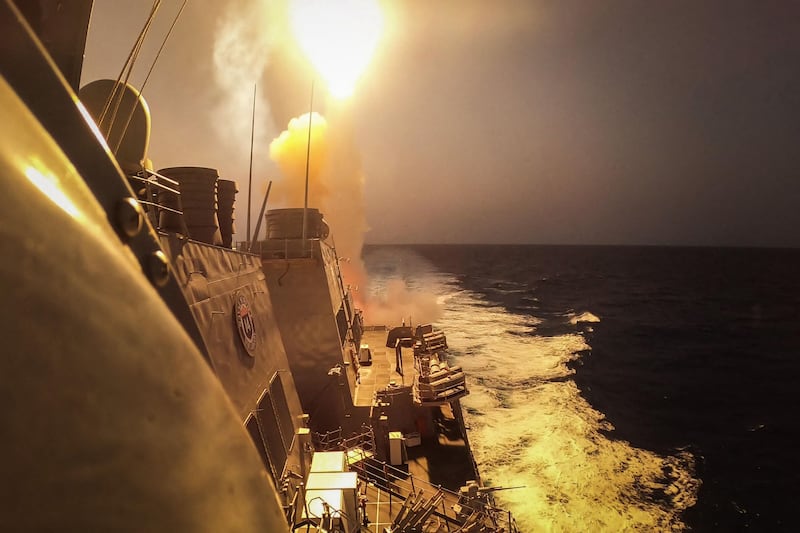 US guided-missile destroyer USS Carney fires at Houthi missiles and drones in the Red Sea. AFP