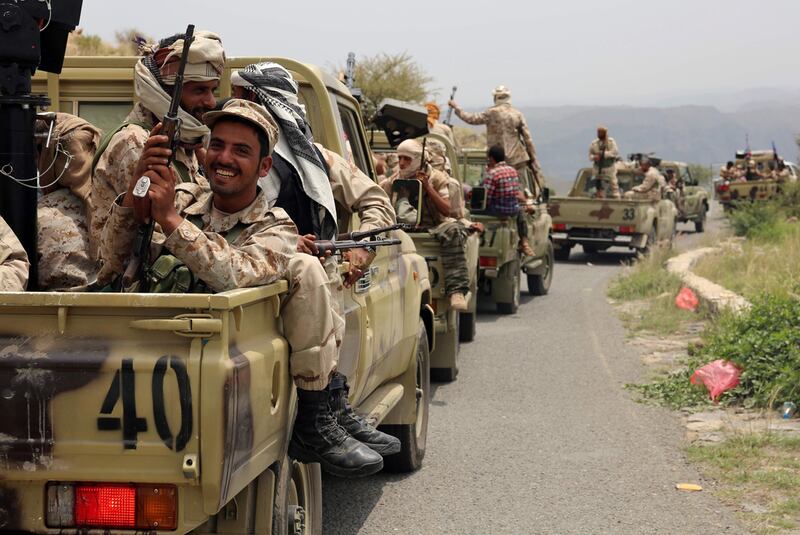 Yemeni fighters loyal to President Abedrabbo Mansour Hadi drive in convoy in the Yafa area, some 180 kilometres north of the port city of Aden, last year. Nabil Hassan / AFP