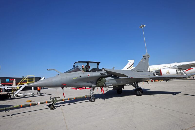 A pilot sitting in a Rafale fighter jet at the 2021 Dubai Airshow. AFP