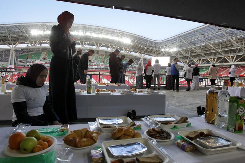 Muslims pray as they gather for Iftar, the meal to end their fast at sunset, during Ramadan, at Kazan Arena Stadium in Kazan, Russia. Reuters