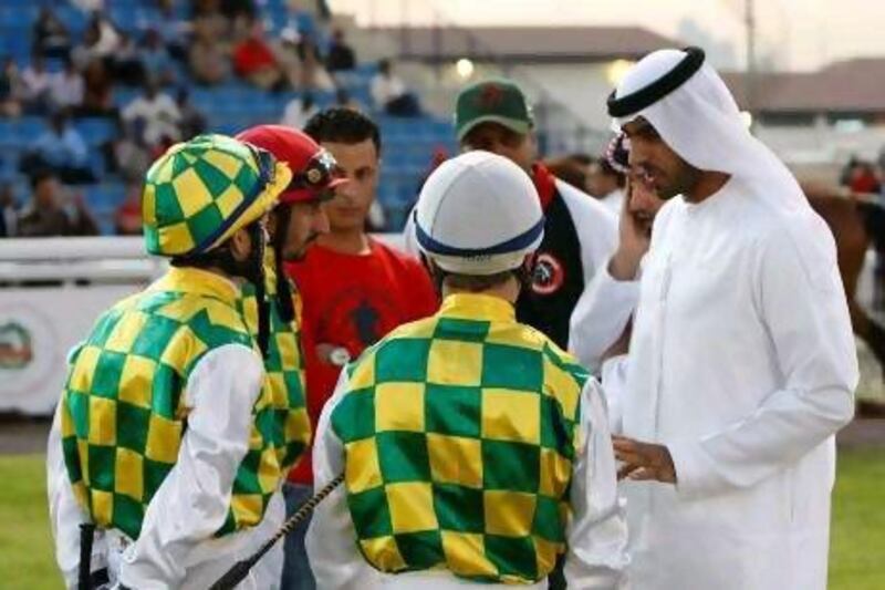 Majed Al Jahouri, right, the principal trainer for Sheikh Mansour’s Al Wathba Stables, says Areem has the best credentials out of his three entries for tonight’s UAE Arabian Derby.