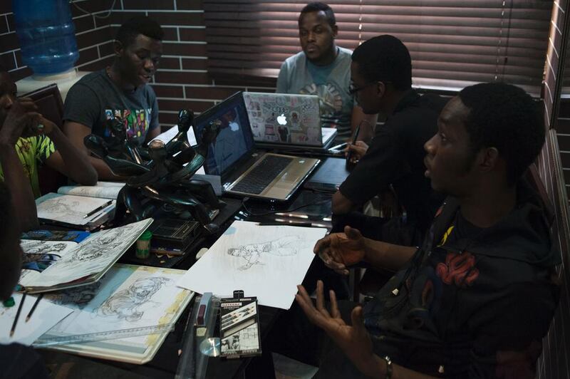 Illustrators discuss ideas at the Comic Republic office in Lagos. Stefan Heunis / AFP
