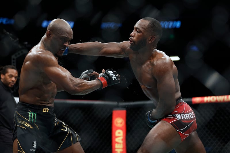 Kamaru Usman, left, fights Leon Edwards during UFC 278 at Vivint Arena. USA TODAY Sports