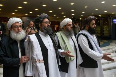 Senior Taliban member Abdul Ghani Baradar, second left, has been leading the Afghan insurgent group's peace talks with the United States. AP Photo