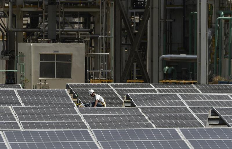 India’s solar power prices have been hitting record lows, coming in cheaper than fossil fuel prices, which bodes well for India meeting its renewables targets. Chandan Khanna / AFP
