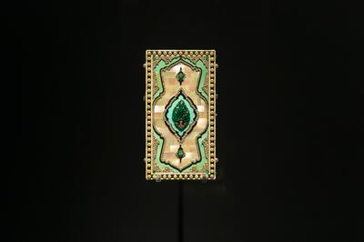 A vanity case, 1924, by Cartier, which uses mother of pearl, gold, platinum, emerald, pearl, diamond and turquoise. Photo: Department of Culture and Tourism – Abu Dhabi