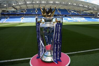 (FILES) In this file photo taken on August 12, 2017 The Premier league trophy sits beside the pitch ahead of the English Premier League football match between Brighton and Hove Albion and Manchester City at the American Express Community Stadium in Brighton. Premier League clubs will meet on May 1, 2020, to discuss whether it is realistic to complete the season during the coronavirus crisis or whether they will have to brace for a devastating financial hit. - RESTRICTED TO EDITORIAL USE. No use with unauthorized audio, video, data, fixture lists, club/league logos or 'live' services. Online in-match use limited to 75 images, no video emulation. No use in betting, games or single club/league/player publications. / AFP / CHRIS J RATCLIFFE / RESTRICTED TO EDITORIAL USE. No use with unauthorized audio, video, data, fixture lists, club/league logos or 'live' services. Online in-match use limited to 75 images, no video emulation. No use in betting, games or single club/league/player publications.