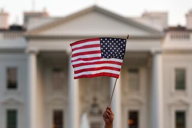 In this September 2017 file photo, a flag is waved outside the White House, in Washington. AP