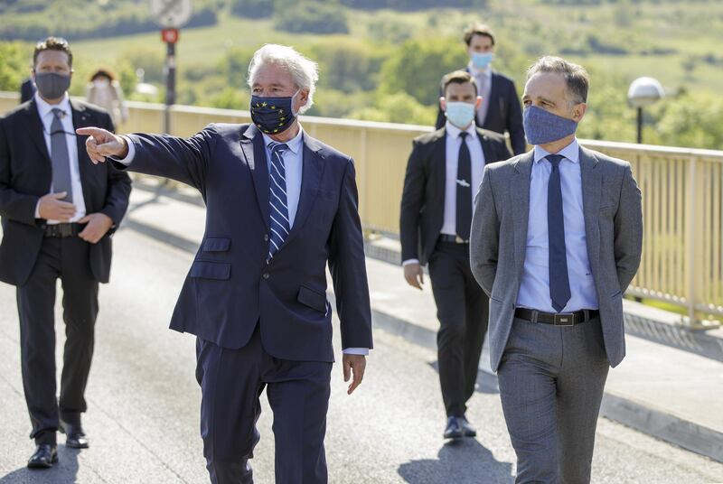 SCHENGEN, LUXEMBOURG - MAY 16: Federal Foreign Minister Heiko Maas, SPD (R), and Foreign Minister of Luxembourg, Jean Asselborn, visit the Europa Museum together after reopening the common border on the Moselle bridge between the cities of Perl and Schengen after the coronavirus-related closure on May 16, 2020 in Schengen, Luxembourg. (Photo by Thomas Imo - Pool/Getty Images)