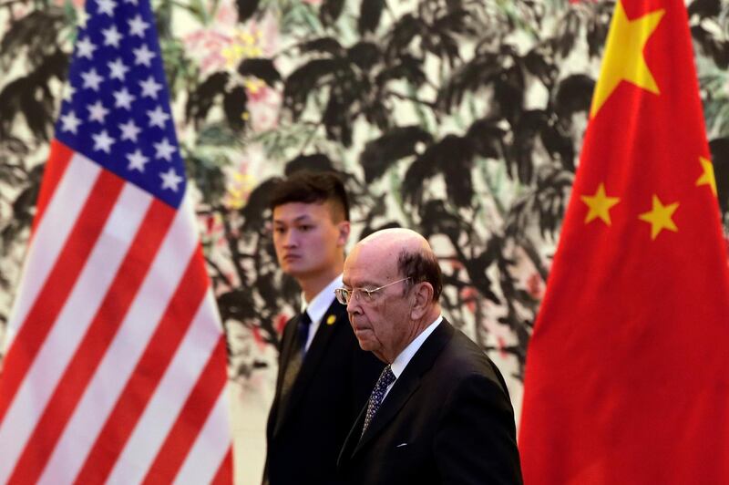 U.S. Commerce Secretary Wilbur Ross arrives to the Diaoyutai State Guesthouse to attend a meeting with Chinese Vice Premier Liu He in Beijing, Sunday, June 3, 2018. U.S. Commerce Secretary Ross is in Beijing for talks on China's promise to buy more American goods after Washington ratcheted up tensions with a new threat of tariff hikes on Chinese high-tech exports. ( (AP Photo/Andy Wong, Pool)
