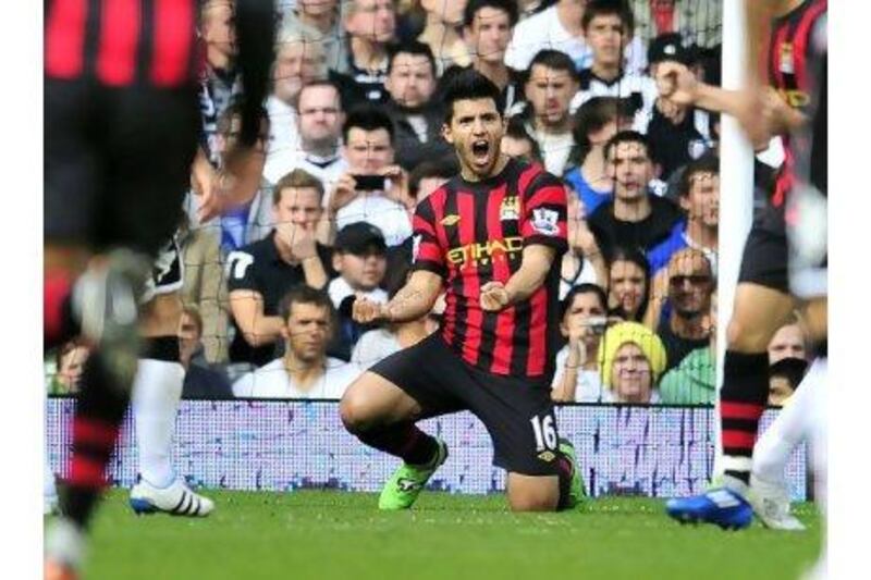 Manchester City's Argentinian striker Sergio Aguero celebrates scoring the opening goal of the English Premier League football match between Fulham and Manchester City at Craven Cottage in London. AFP