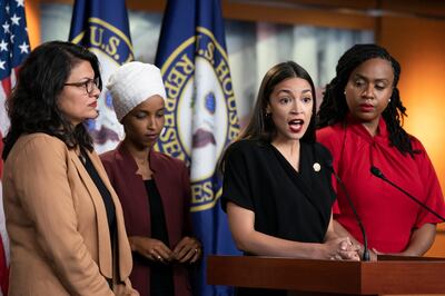 In this July 15, 2019, photo, Rep. Alexandria Ocasio-Cortez, D-N.Y., speaks as, from left, Rep. Rashida Tlaib, D-Mich., Rep. Ilhan Omar, D-Minn., and Rep. Ayanna Pressley, D-Mass., listen during a news conference at the Capitol in Washington. Long before President Donald Trump attacked the four Democratic congresswomen of color, saying they should â€œgo backâ€ to their home countries, they were targets of hateful rhetoric and disinformation online.(AP Photo/J. Scott Applewhite)