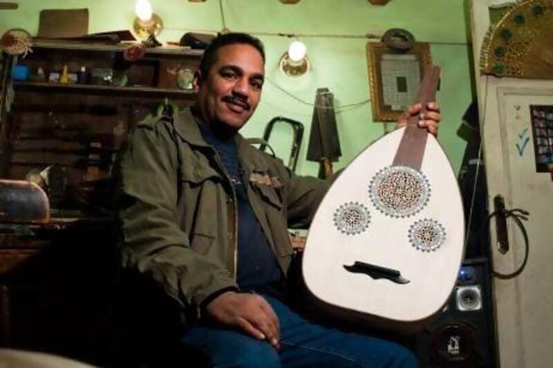 The oud maker Saed Fathy Amin shows off one of his finished works. Laurence Underhill