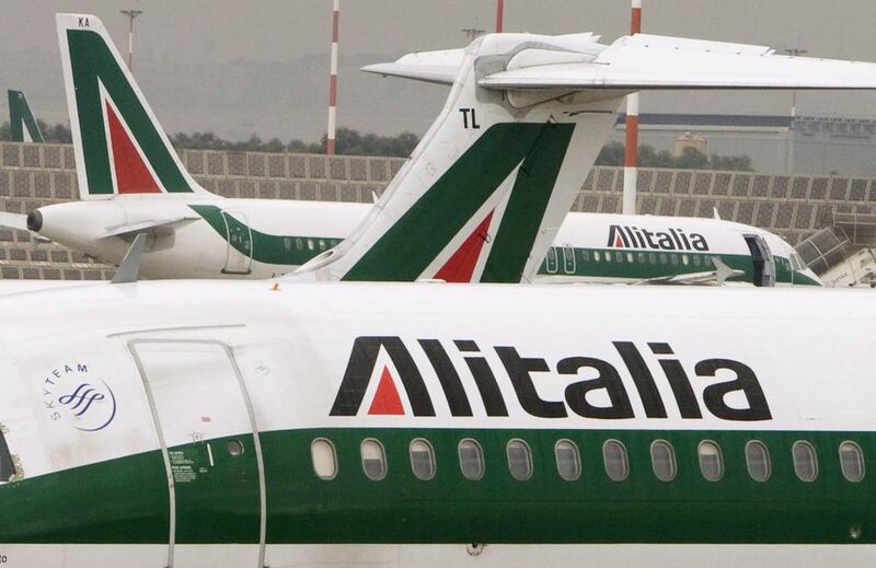 Alitalia, which employs 14,000 people, would have to cut jobs to meet conditions set by Etihad Airways. Tony Gentile / Reuters
