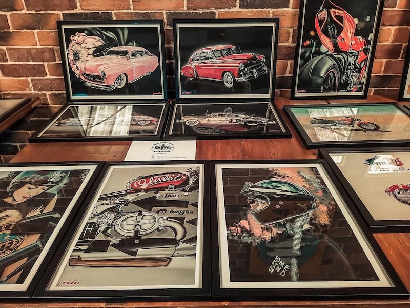 A collection of motorcycle-themed art by Ukrainian artist Masha at 2020's Art of Motorcycles event