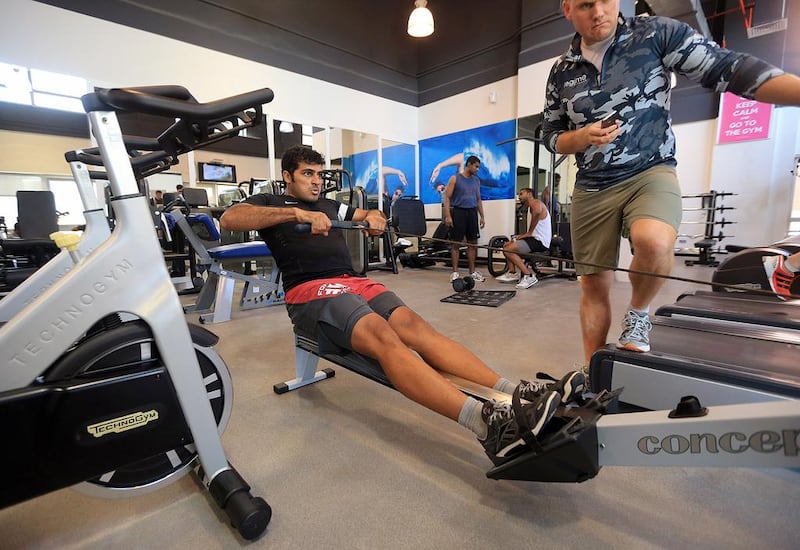 The du employee Saoud Al Mudharreb participates in a fitness challenge, which was a part of Wellness Programme at his office in Dubai. Satish Kumar / The National