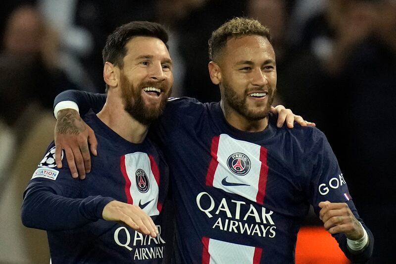 PSG's Neymar, right, celebrates with Messi after scoring the third goal. AP