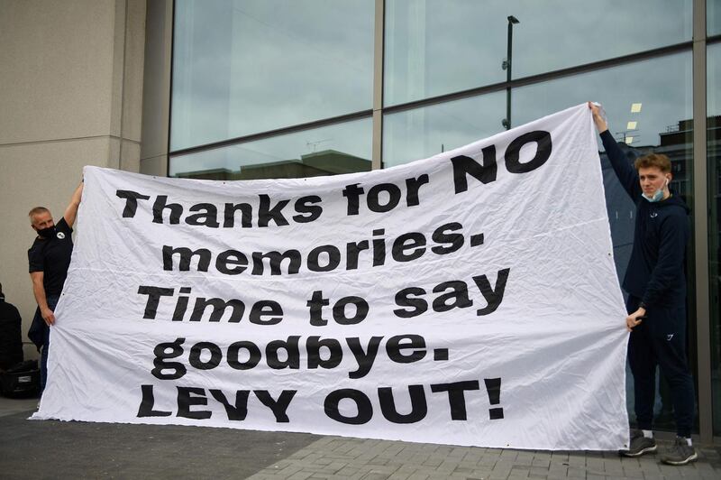 Tottenham fans hold a banner making clear their disdain for the club's hierarchy. AFP