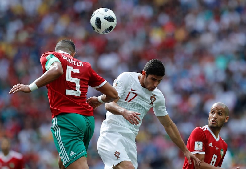 Morocco's Mehdi Benatia, left, and Portugal's Goncalo Guedes go for a header. Hassan Ammar / AP Photo