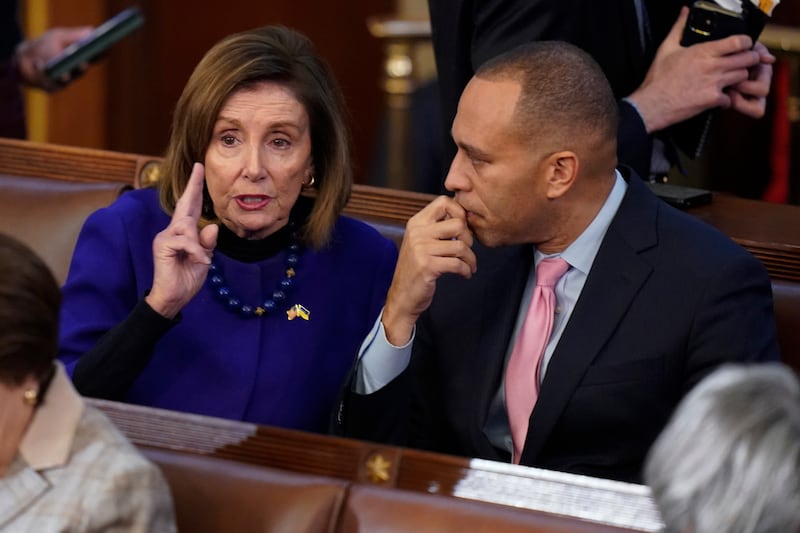 Mr Jeffries speaks with Ms Pelosi during the eighth vote in the chamber as the House meets for the third day to elect a speaker. AP