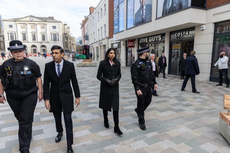 Mr Sunak and Ms Braverman join police for a walkabout in Chelmsford High Street in March. Getty Images