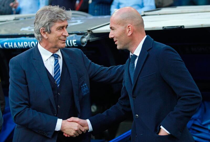 Manuel Pellegrini, the manager of Manchester City, shakes hands with Zinedine Zidane, manager of Real Madrid. Gonzalo Arroyo Moreno/Getty Images
