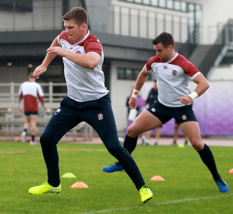 Owen Farrell, left, warms up with team mate George Ford. Getty