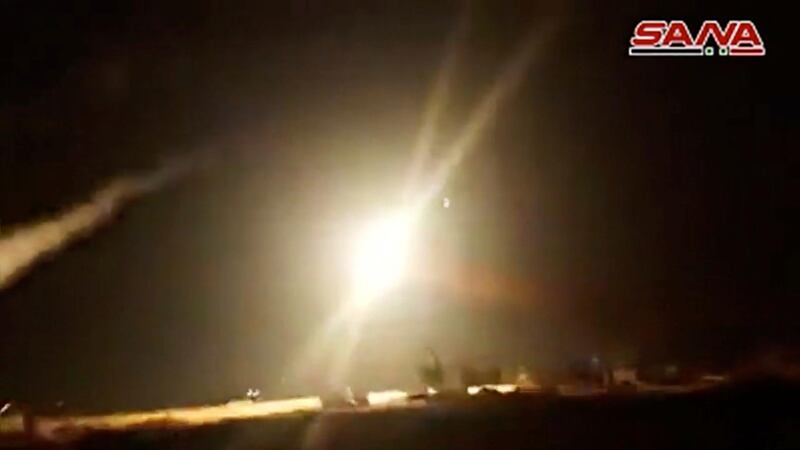 A still image from a video footage shows what appeared to be missile hitting target in air after surface to air missiles were launched into air by Syrian military in Homs, Syria. Reuters