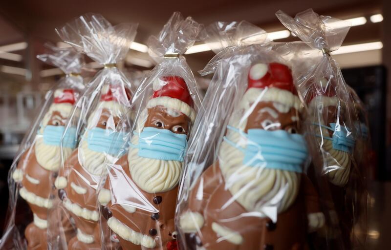 Chocolate Santa Clauses with masks for sale in Pirmasens, Germany. EPA