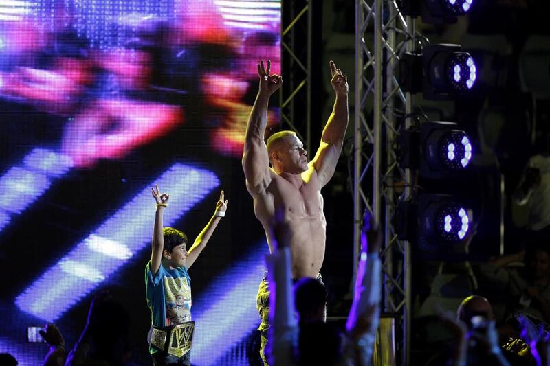 John Cena celebrates defeating Seth Rollins. Christopher Pike / The National