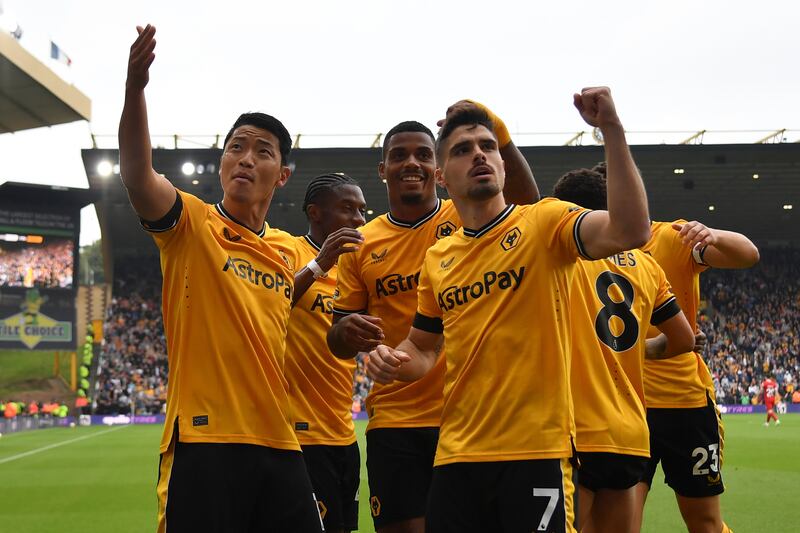 Wolves attacker Hwang Hee-chan celebrates with teammates after his early goal. AP