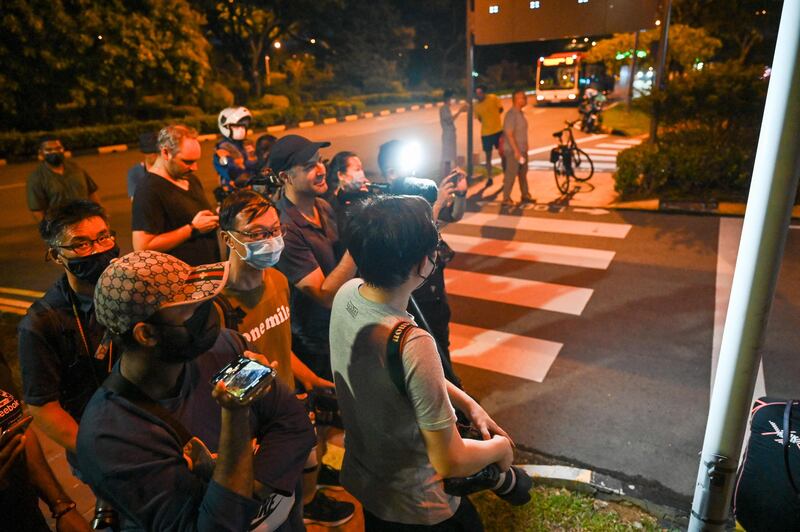 Members of the media wait outside the VIP complex of Changi International Airport in Singapore for the arrival of Mr Rajapaksa, his wife and two bodyguards. Sri Lanka's president left the Maldives on July 14 aboard a Saudia Airlines plane bound for Singapore. AFP