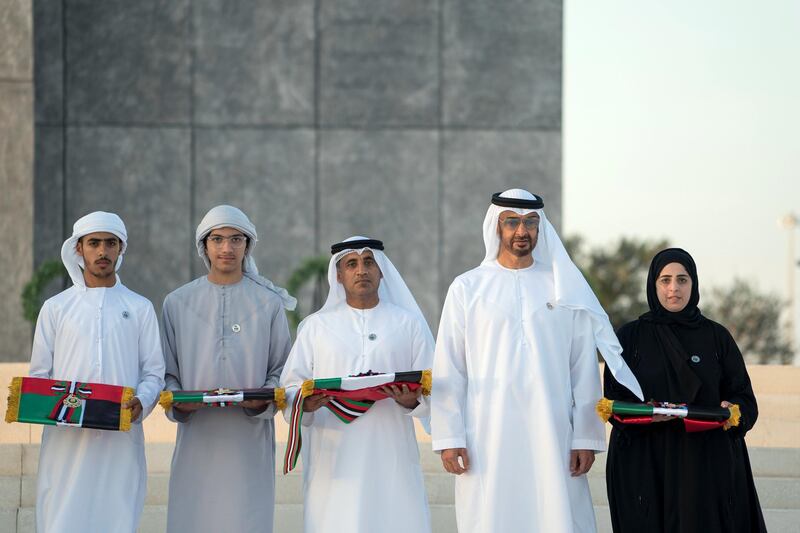 ABU DHABI, UNITED ARAB EMIRATES - November 30, 2017: HH Sheikh Mohamed bin Zayed Al Nahyan, Crown Prince of Abu Dhabi and Deputy Supreme Commander of the UAE Armed Forces (2nd R), stands for a group photo with the families of Martyrs during a Commemoration Day ceremony at Wahat Al Karama, a memorial dedicated to the memory of UAE’s National Heroes in honour of their sacrifice and in recognition of their heroism.
( Mohamed Al Hammadi / Crown Prince Court - Abu Dhabi )
---