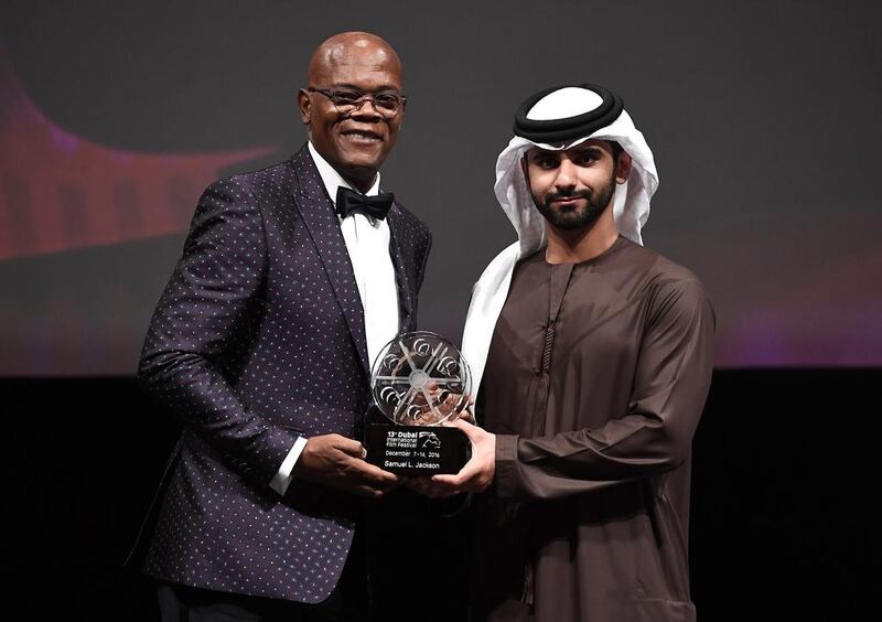 Samuel L Jackson receives the Lifetime Achievement award from Sheikh Mansoor bin Mohammed at the Opening Night Gala during day one of the 13th annual Dubai International Film Festival.  Gareth Cattermole / Getty Images for DIFF