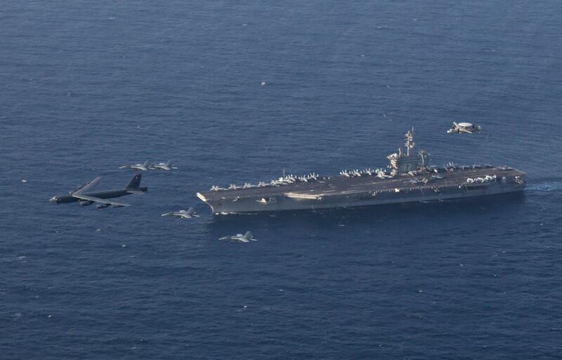 The USS Abraham Lincoln carrier and a US Air Force B-52H Stratofortress, conduct joint exercises in the US Central Command area of responsibility in Arabian sea. US Navy via AP