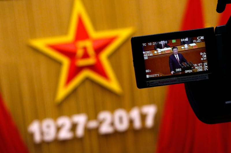 A camera monitor shows Chinese President Xi Jinping speaking during a ceremony to commemorate the 90th anniversary of the founding of the People's Liberation Army, at the Great Hall of the People in Beijing. Xi issued a tough line on national sovereignty amid multiple territorial disputes with his country's neighbors, saying China will never permit the loss of "any piece" of its land to outsiders. Andy Wong.