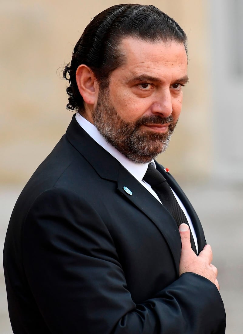 Lebanon's Prime Minister Saad Hariri gestures as he leaves The Elysee Presidential Palace in Paris on September 30, 2019, following a luncheon after a church service for former French President Jacques Chirac. Former French President Jacques Chirac died on September 26, 2019 at the age of 86. / AFP / Bertrand GUAY
