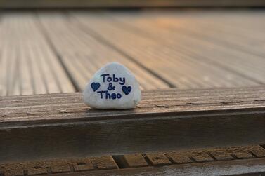 Toby and Theo's names on this stone allow their family to take the twins with them wherever they go. 