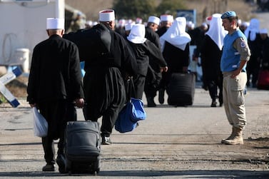 Golan Heights Druze walk through a UN crossing to Syria to go to Suwaida for a religious occasion in 2015. EPA