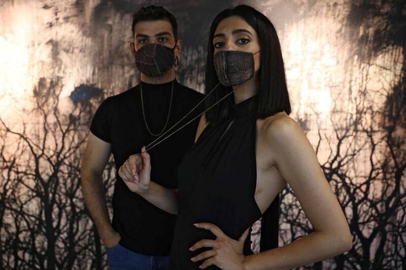 Models present face masks made using aubergine skin by Jordanian chef Omar Sartawi. Reuters
