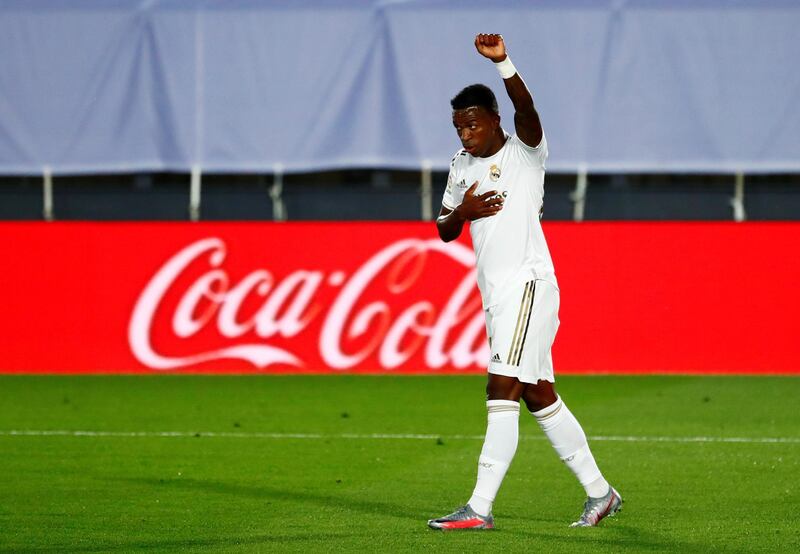 Vinicius Junior celebrates scoring the first goal with a raised fist. Reuters