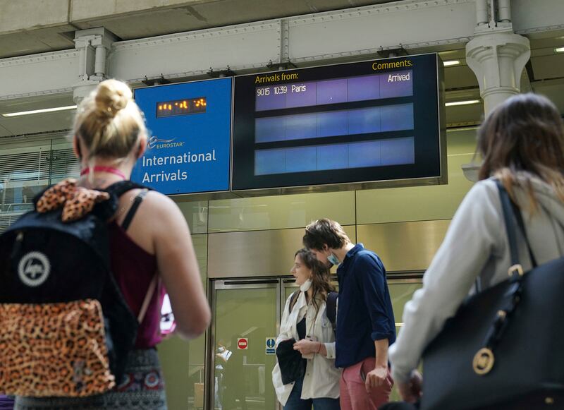 Travellers arrive from France on the Eurostar train at St Pancras International railway station in London. AP