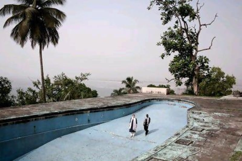 Emma Thompson and her 24-year-old adopted son, Tindy, explore the remains of the infamous Ducor Palace Hotel in Monrovia, Liberia. Anastasia Taylor-Lind